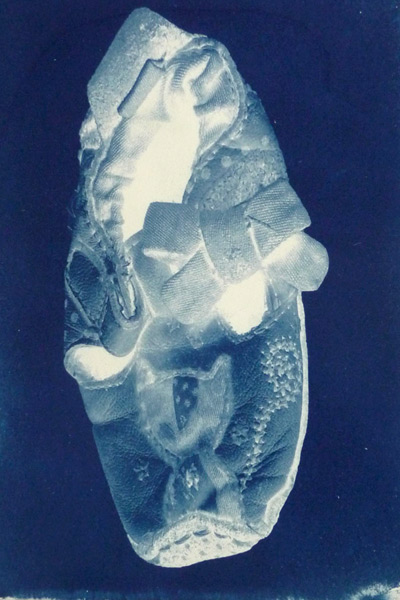 cyanotype of a childs shoe